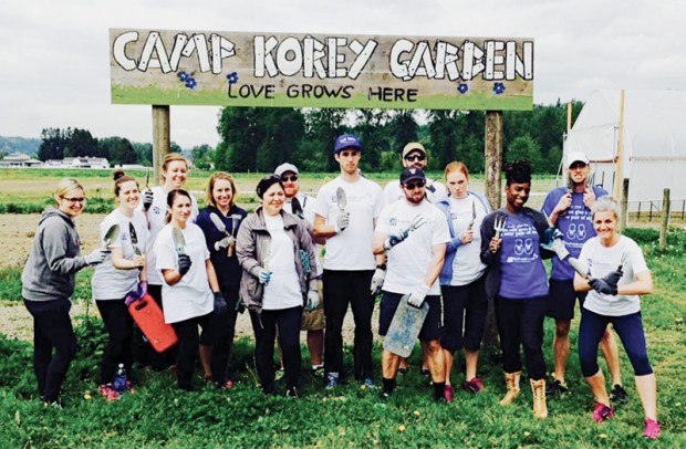 A 14-person team from Brooks after planting four acres of organic gardens for campers at Camp Korey in Carnation, WA.