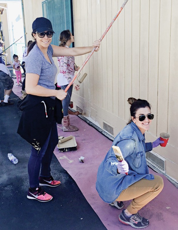 Workers from seven shoe companies come together to give a Southern California school a fresh coat of paint for the Compton Initiative. 