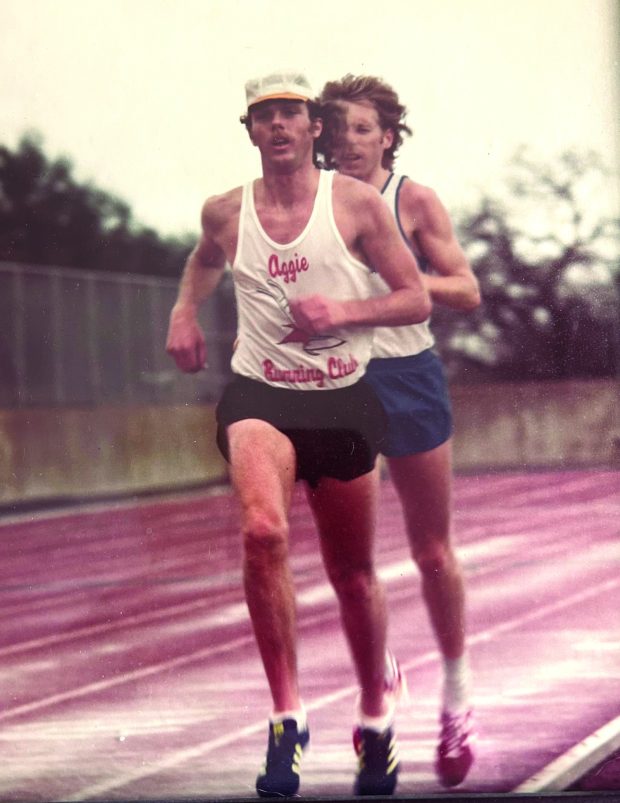 Jim Van Dine paces Bill Rogers on his way to breaking the 25 kilometer world record in 1979.