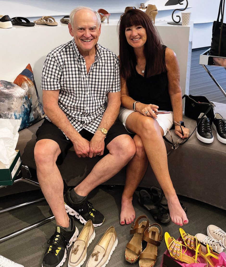 Stanley Eisenman poses with the customer who once purchased 41 pairs and 17 handbags for her and three family members. It was the stores’ largest single sales ticket to date.